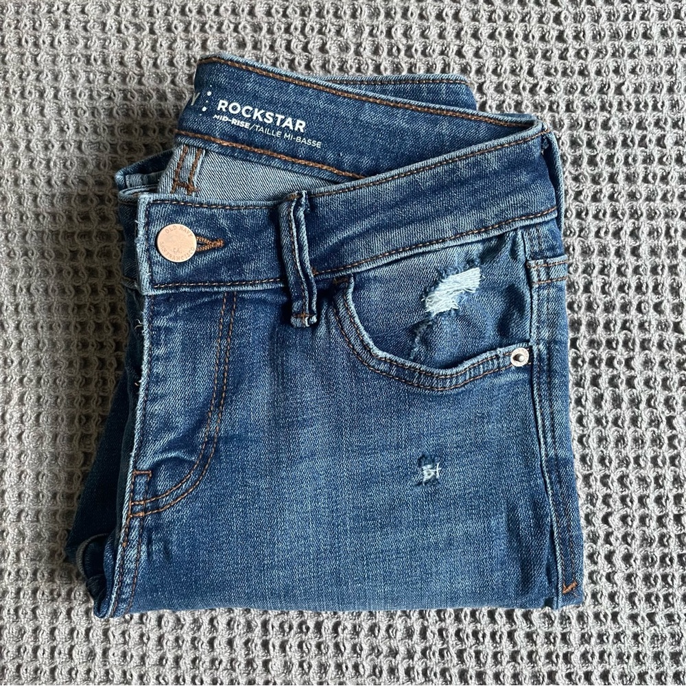 Distressed Low-Rise Denim Jeans